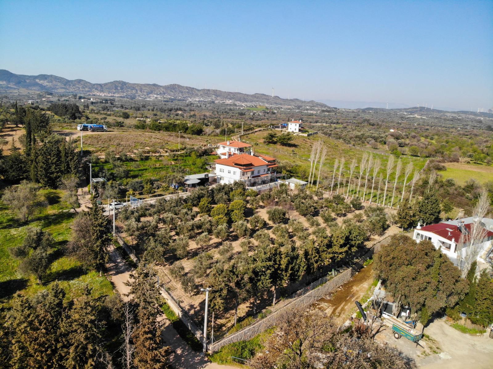 DATÇA'DA İÇİNDE APARTMAAN BULUNAN ARAZİ